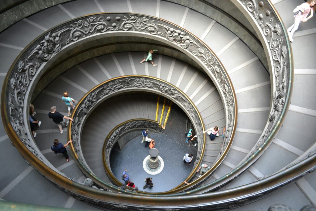 Aerial view of famous spiral staircase in Vatican City, showcasing intricate architecture.
